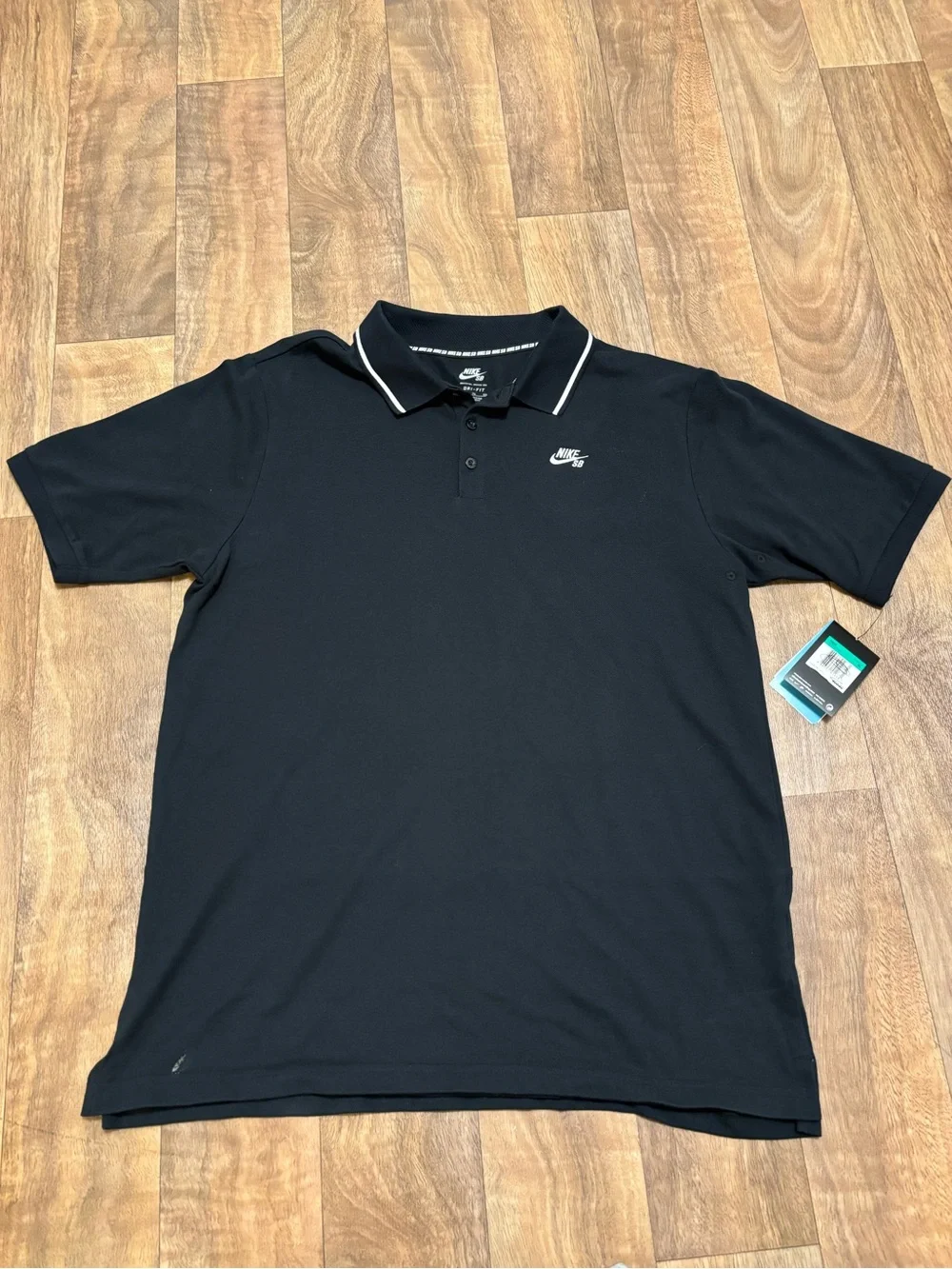 Nike SB Dri-FIT black polo, size XL. New with tags. Really clean classic look.